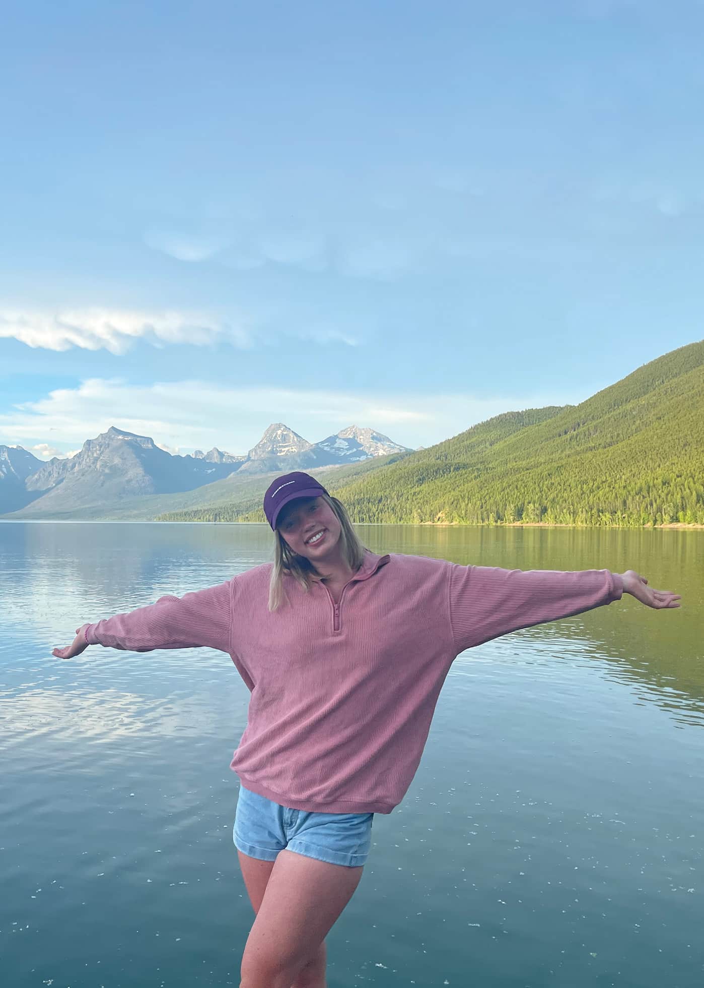 Girl stands a lake McDonald on a trip with Tour Glacier and Sea Me Paddle