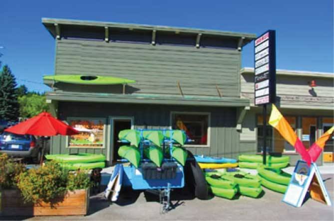 Lakeside Rental and Tour Location with Kayaks and Paddleboards Out Front