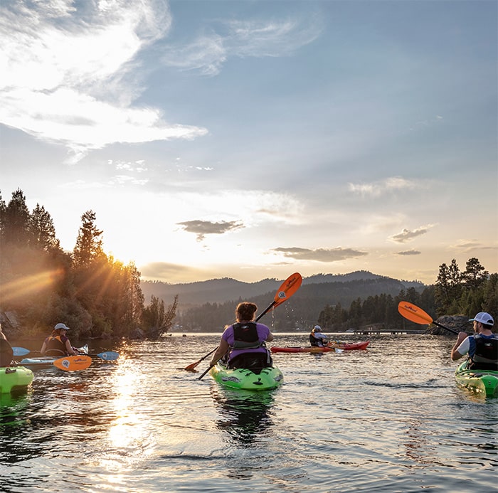 Family paddles on Flathead Lake in Montana with Sea Me Paddle in Sunset
