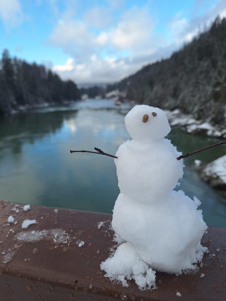 Small snowman built by guests of Tour Glacier on the edge of Belton Bridge