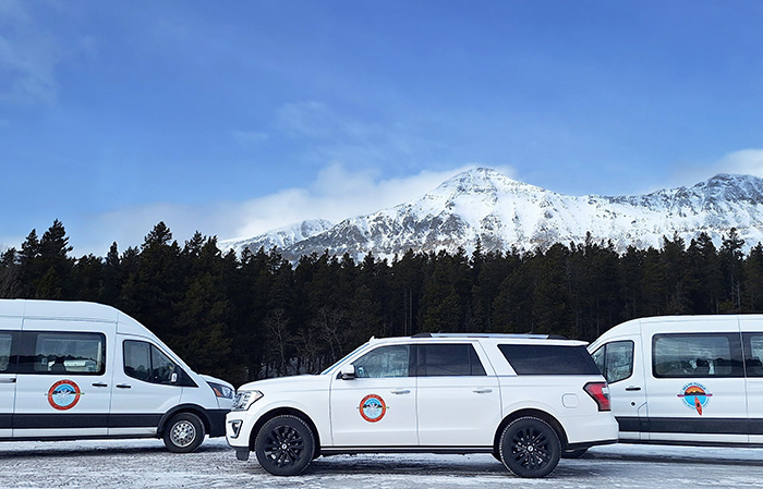 Winter, Glacier National Park driving tour vehicles are ford transit vans or Ford Expedition